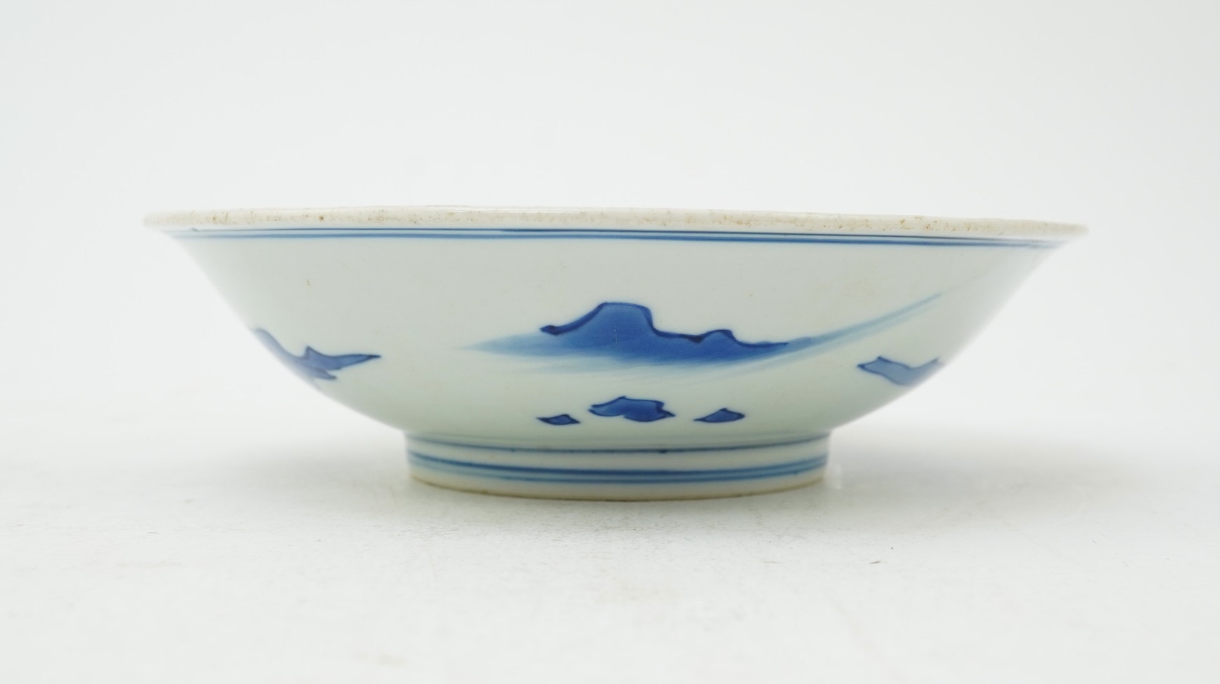 A Chinese blue and white saucer dish, Kangxi six character mark and of the period (1662-1722)